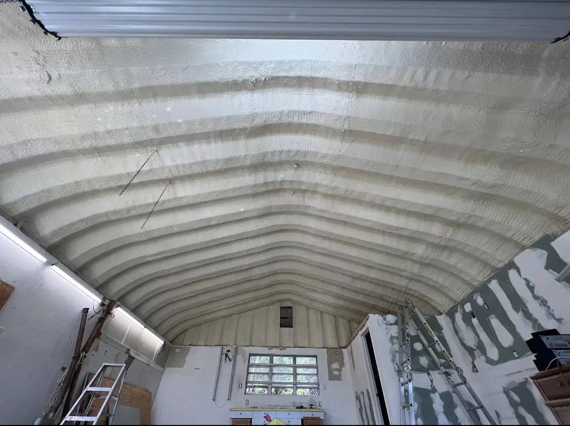 Spray polyurethane foam applied to the underside of a metal roof deck in Zionsville